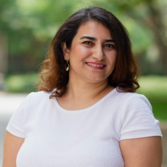  Nikoo Somayeh standing in a park, smiling at the camera